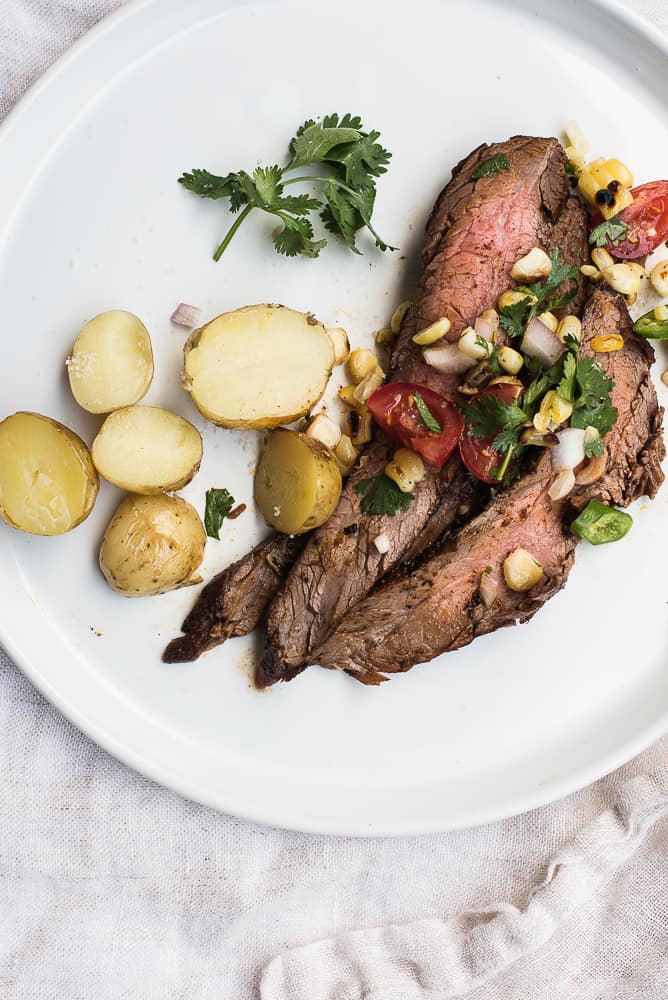 Flank steak with corn salsa and new potatoes