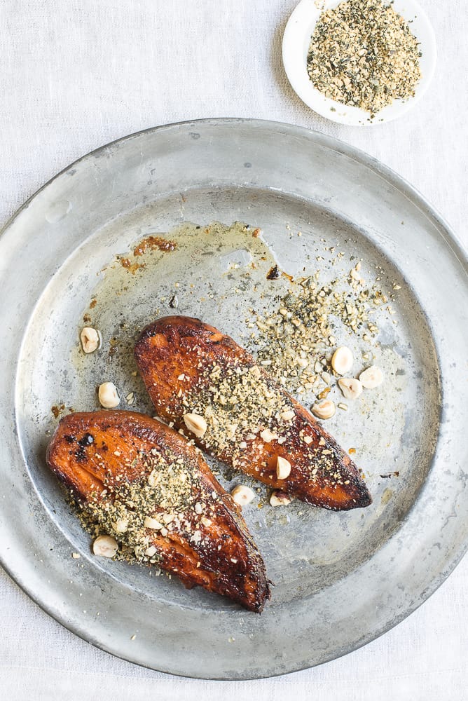Roasted sweet potatoes with crushed pepitas and hazelnuts