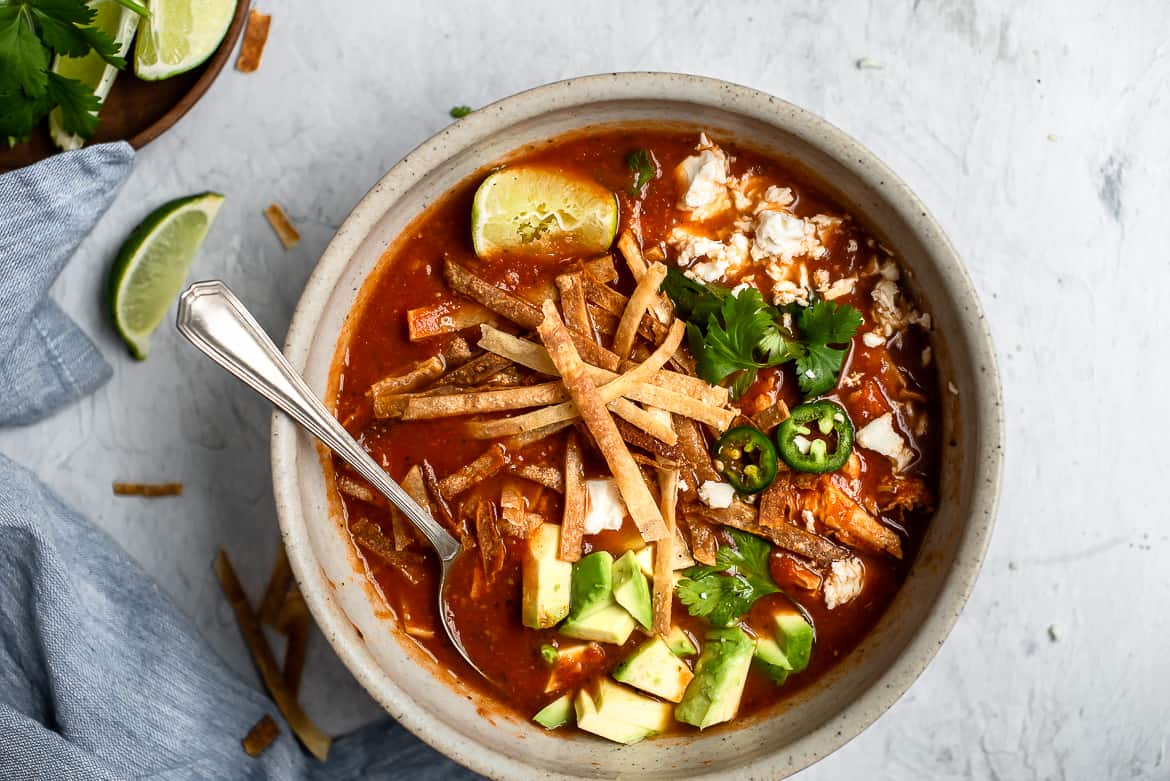 Chicken tortilla soup with toppings