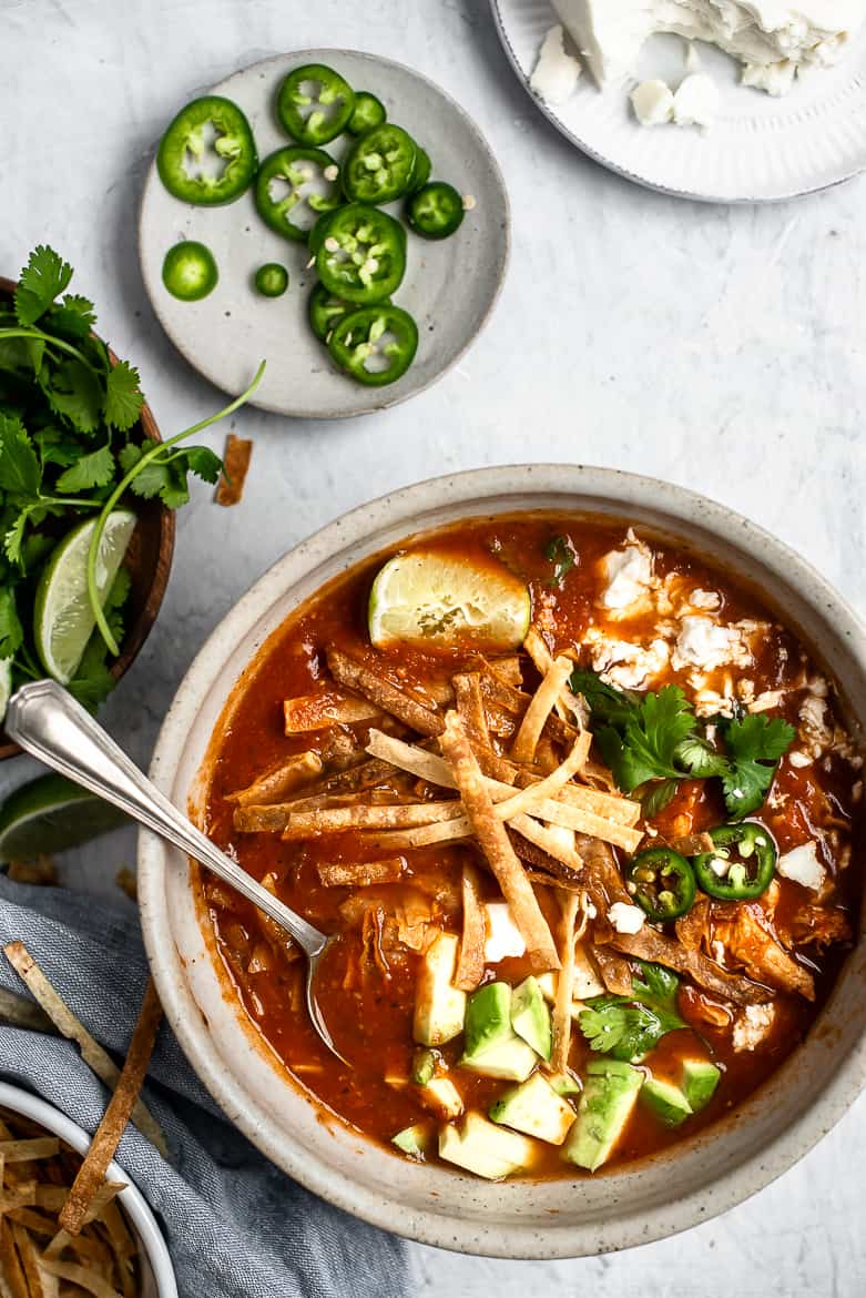 Chicken tortilla soup with toppings