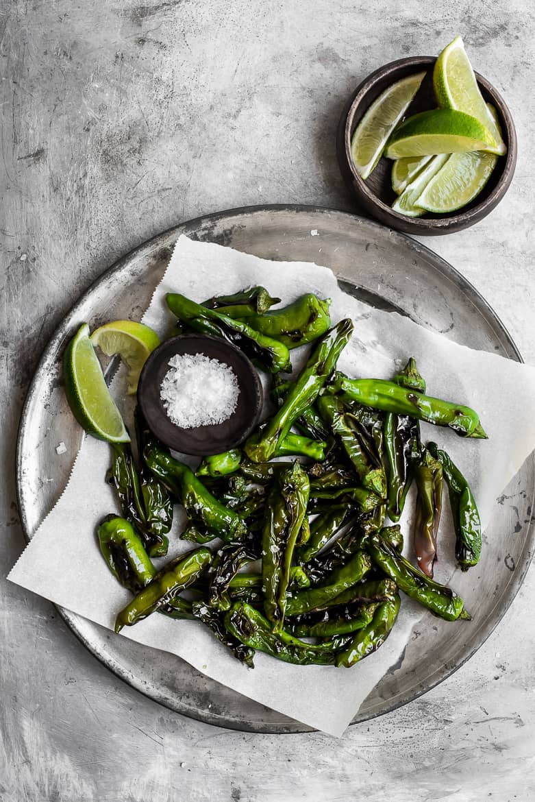 Shishito peppers with flaky salt and limes