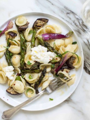 plated orecchiette with charred asparagus, red scallions, eggplant and burrata