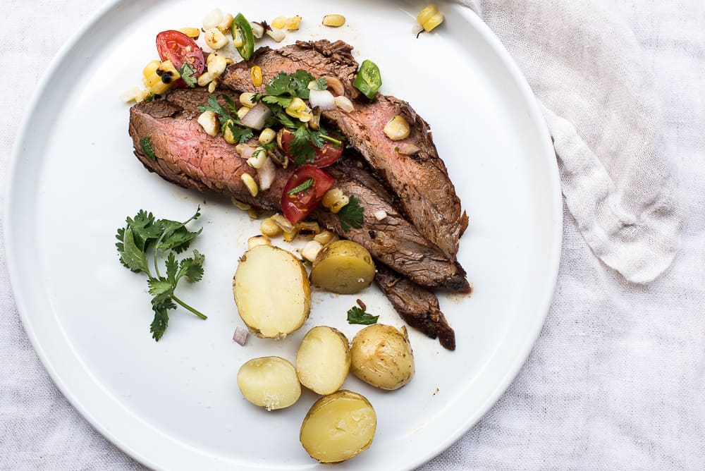 Flank steak with corn salsa and new potatoes