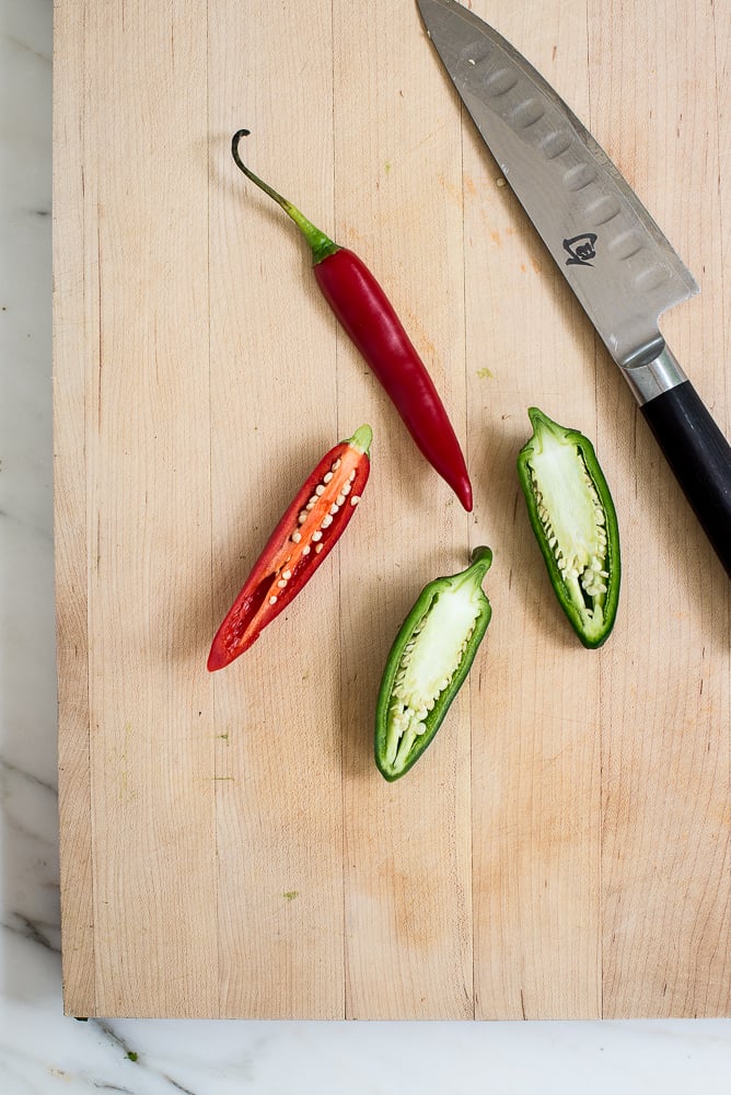 red chili, jalapeño on cutting board