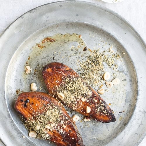 Roasted sweet potatoes with crushed pepitas and hazelnuts