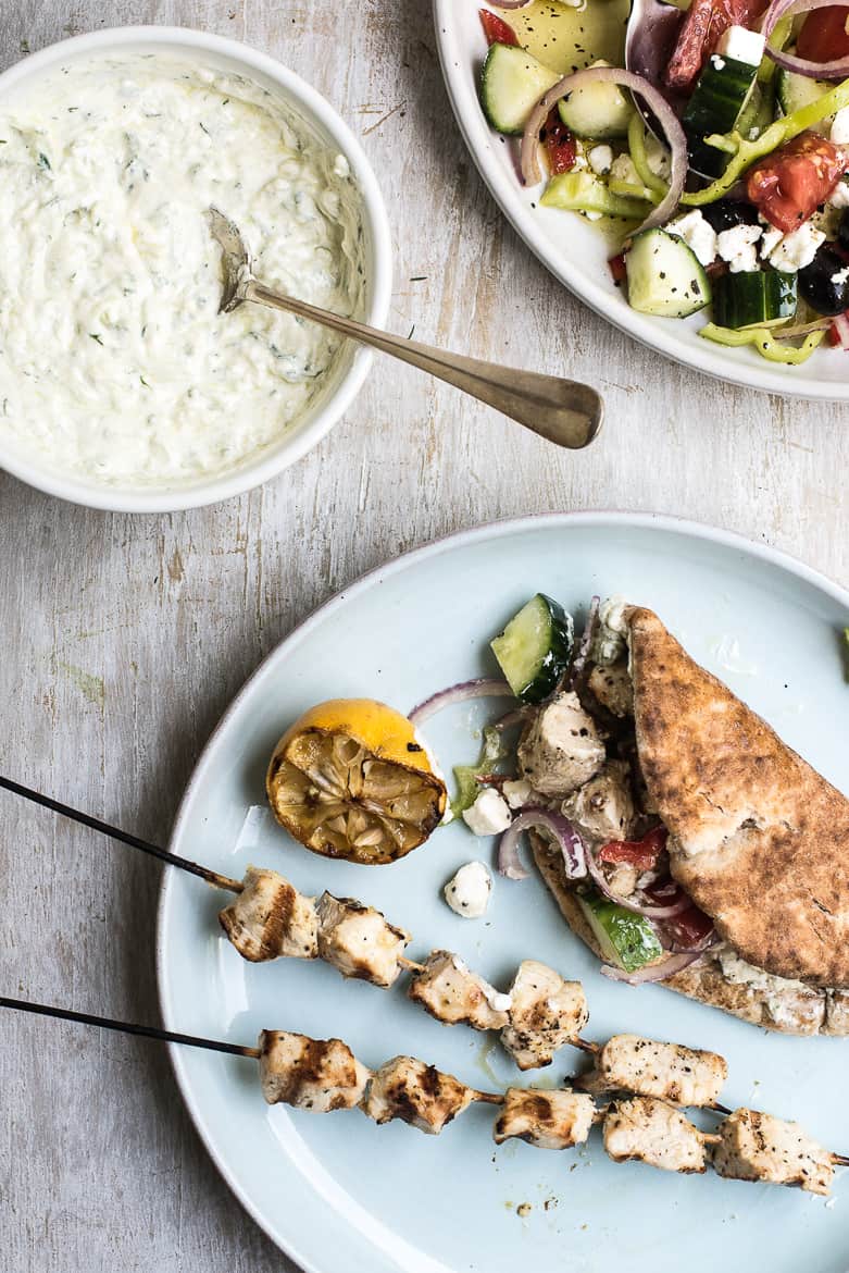 Grilled chicken souvlaki with tzaziki sauce and greek salad