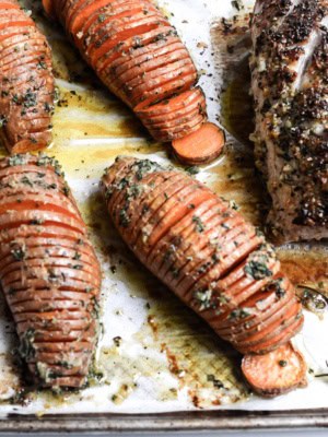 Sheet pan hasselback sweet potatoes and pork roast