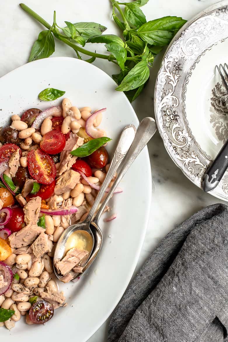 Tuna, white beans and cherry tomatoes on platter