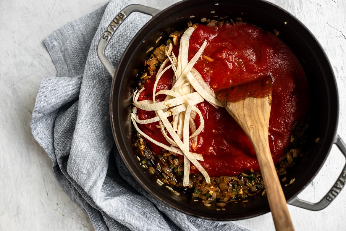 adding tortilla strips to soup