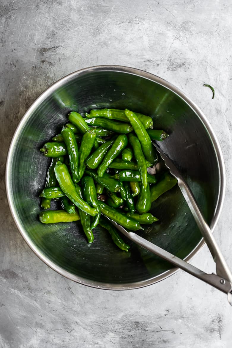 Shishito peppers tossed in bowl