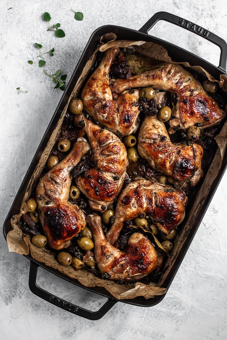 Baked Chicken Marbella in roasting pan with dates