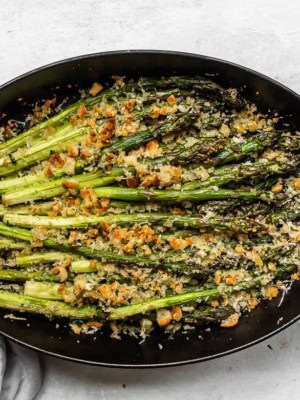 Roasted asparagus topped with lemon, breadscrumbs, and manchego