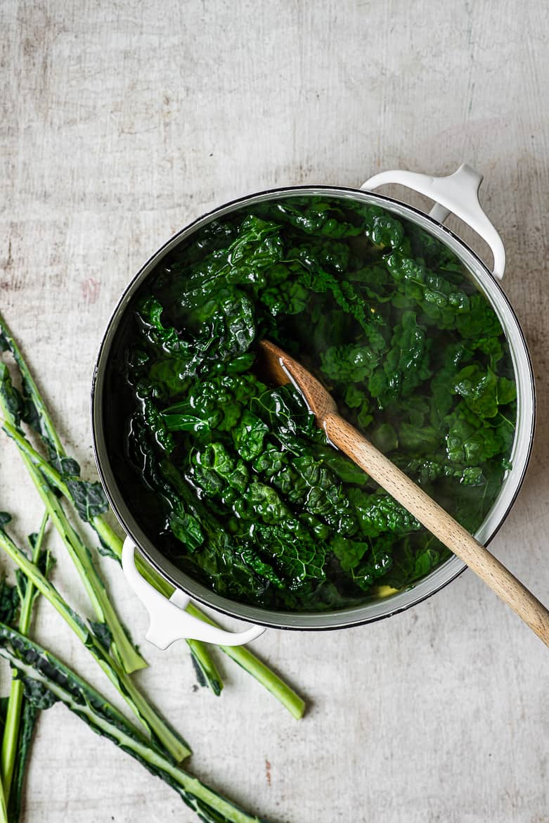 blanched kale leaves in pot 