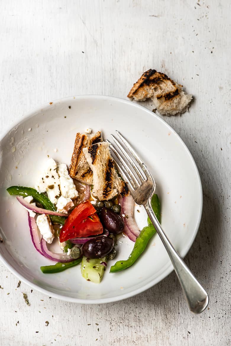 a small bowl with greek salad