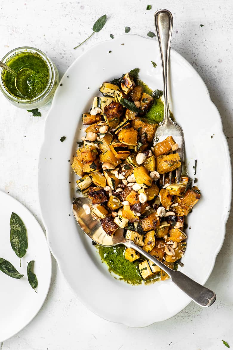 delicata squash with pesto and sage leaves