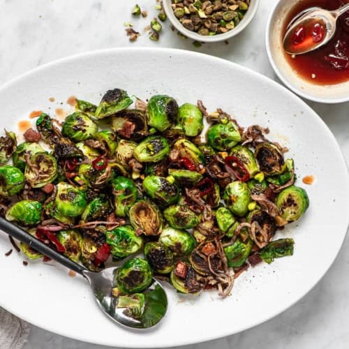 Brussels sprouts with agrodolce sauce on platter