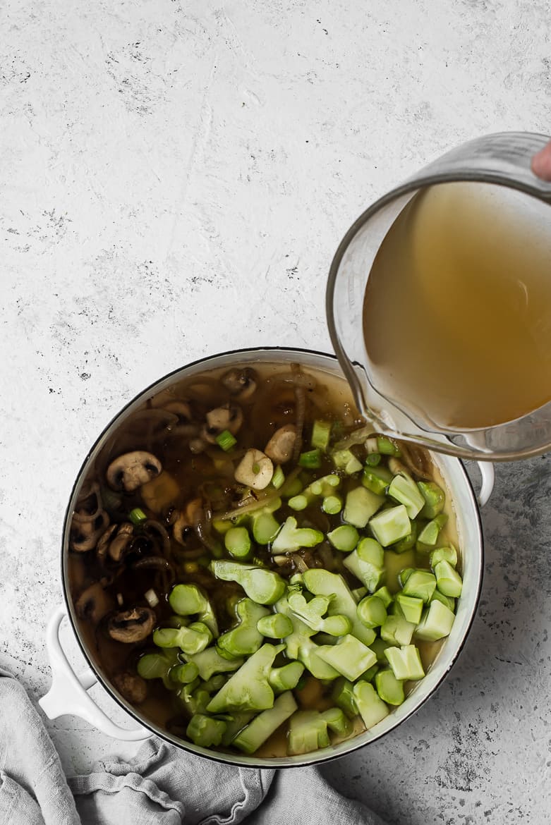 pouring stock into pot