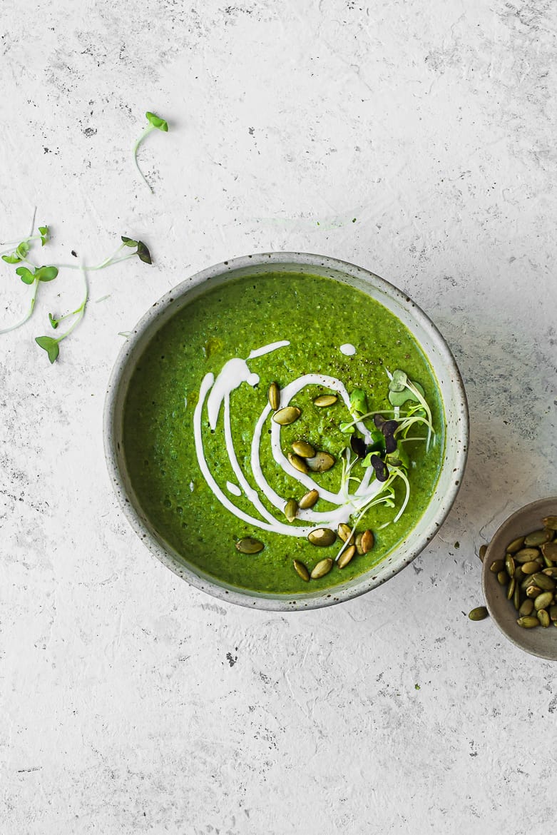 super green soup in bowl with pepitas
