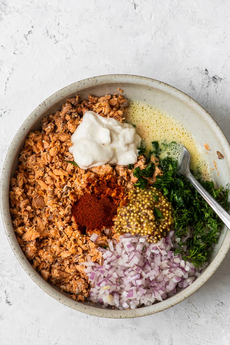 Ingredients for salmon cakes in bowl