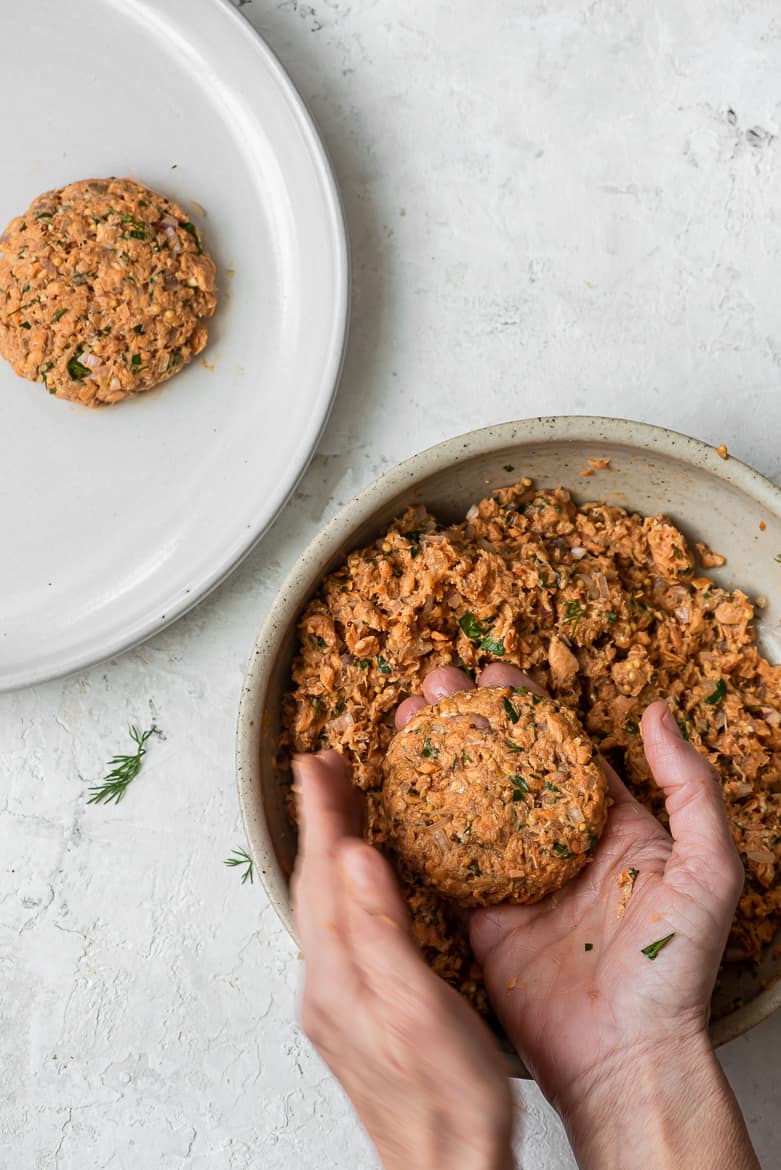 Forming salmon cakes with hands