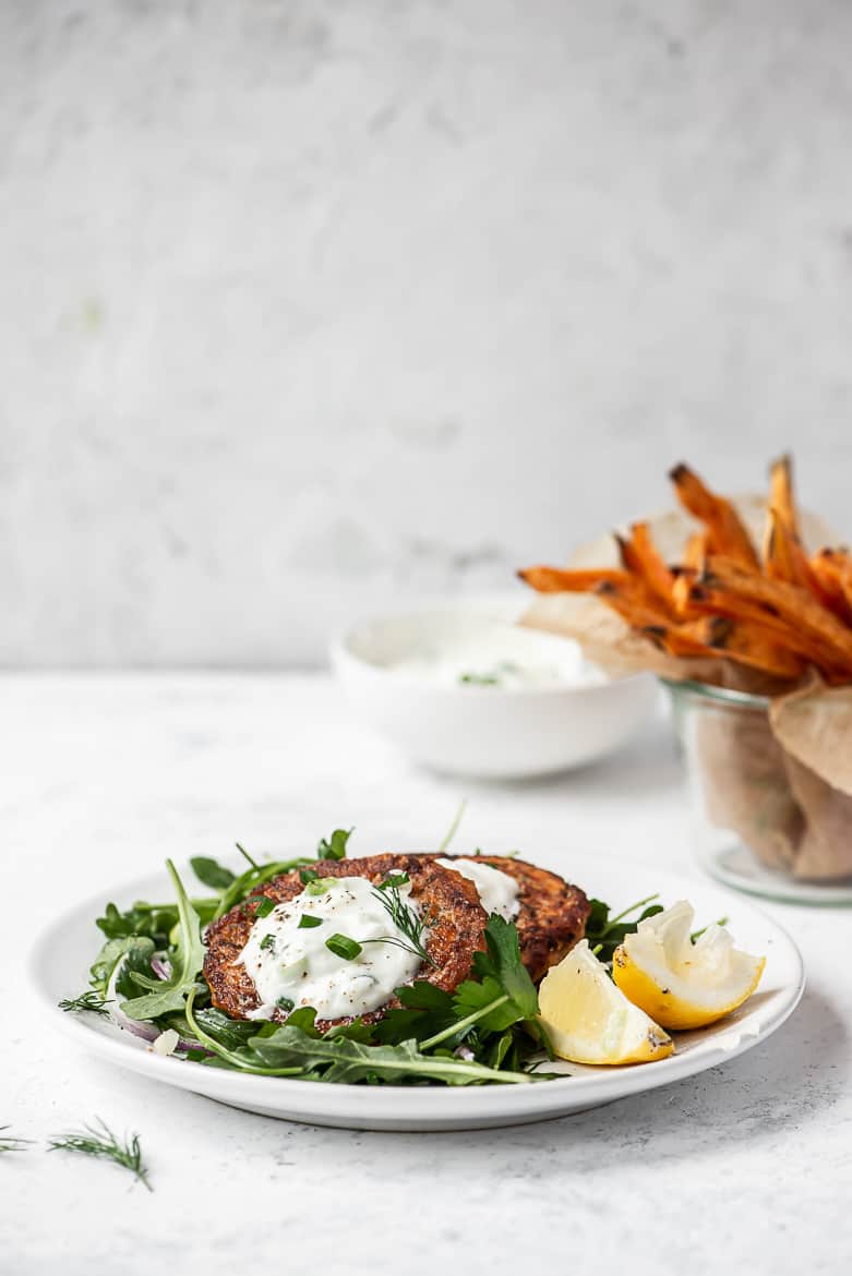 Side shot of salmon cakes on plate