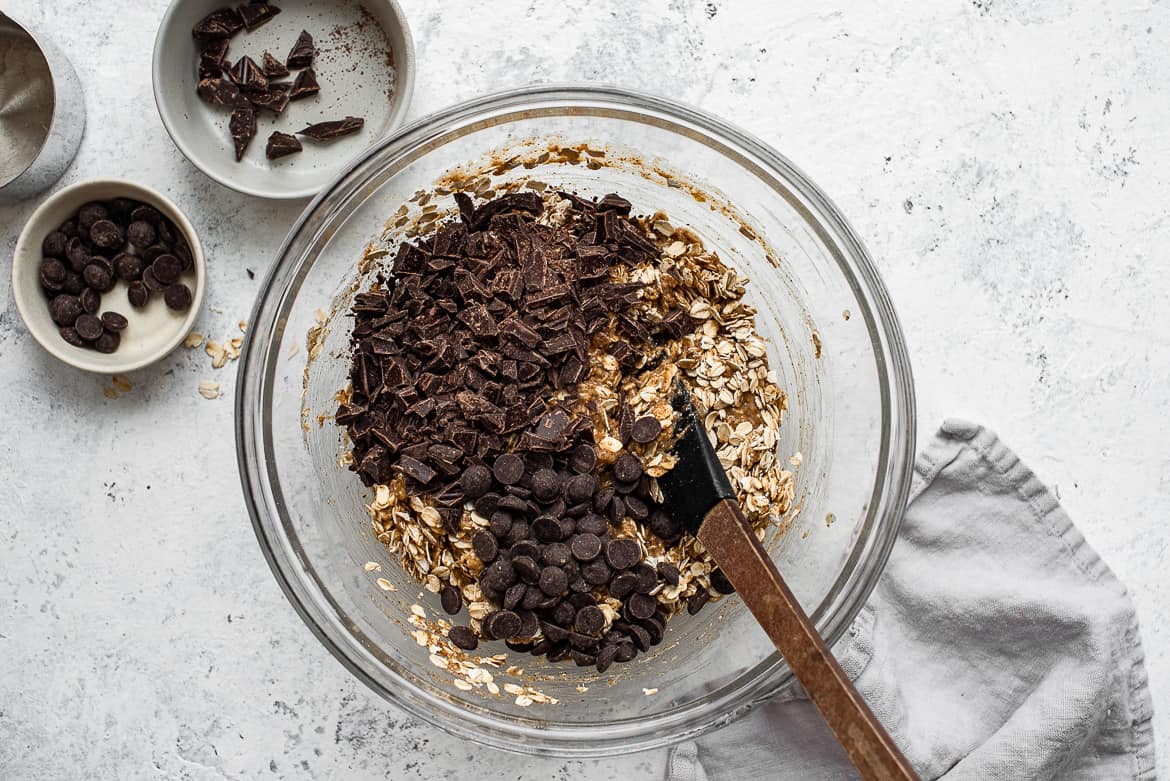 Adding chocolate chips to banana mixture