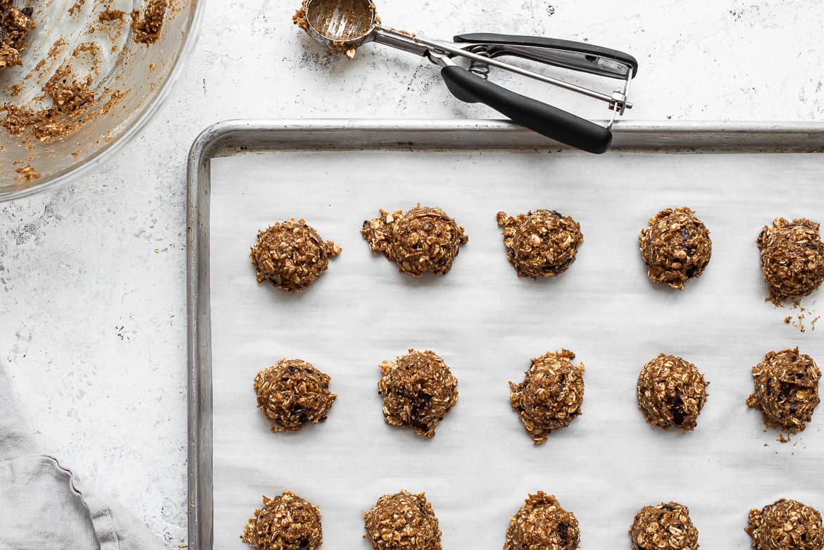 scooping cookies onto baking sheet