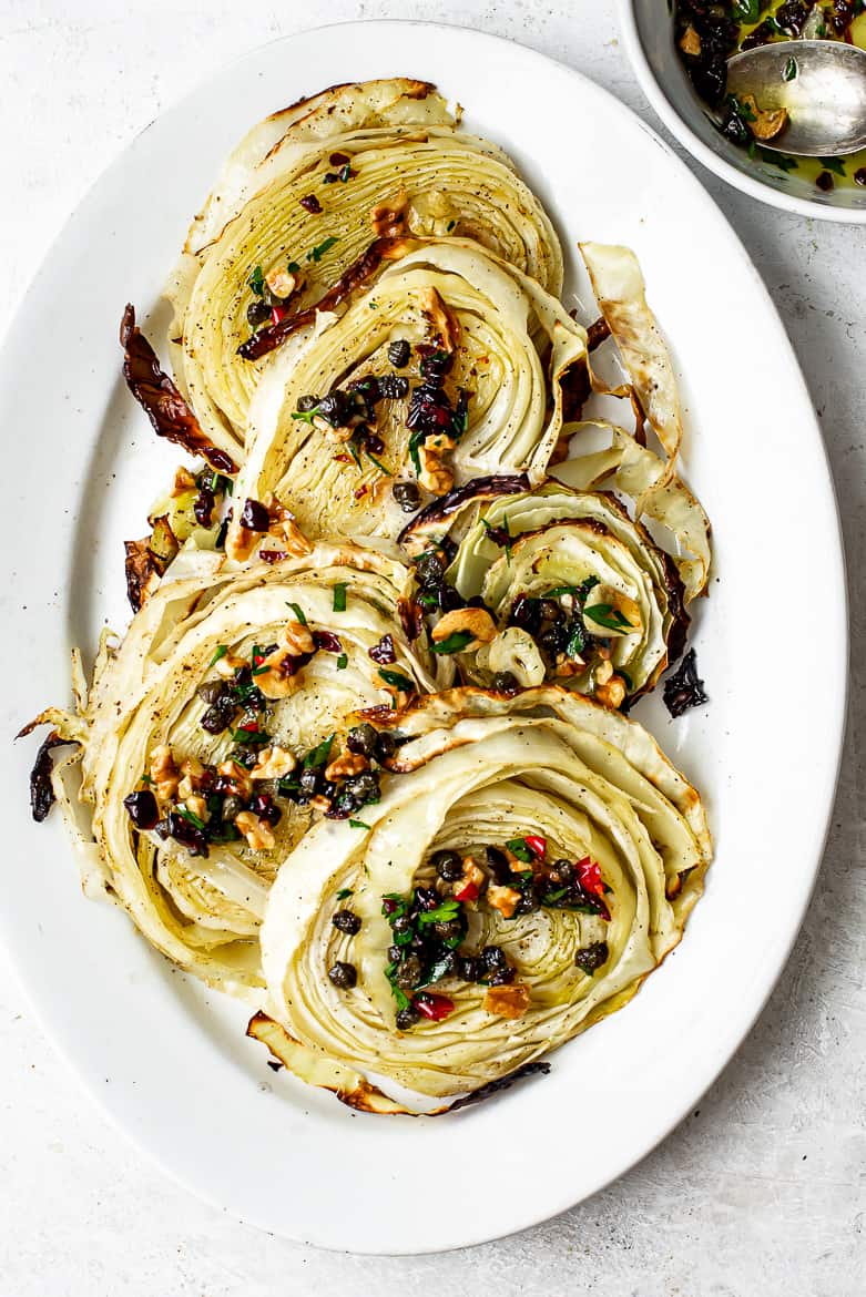 Roasted cabbage steaks topped with walnut salsa