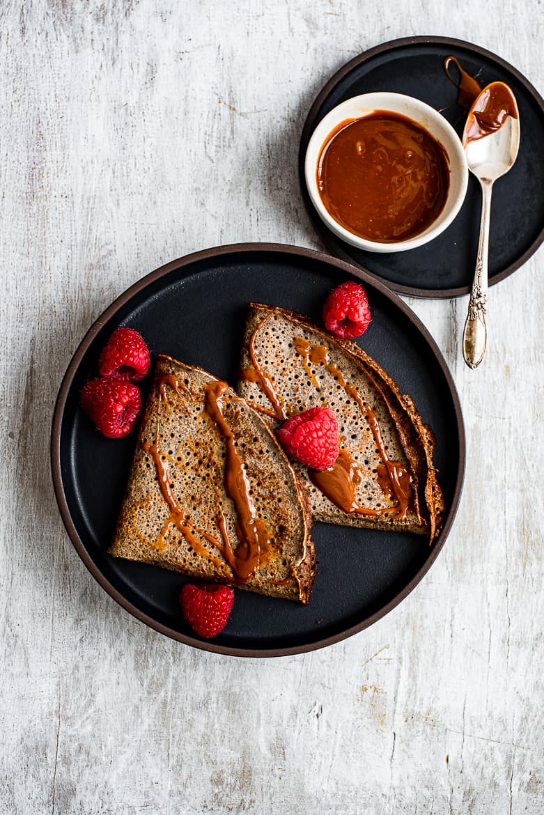 crepes on plate with drizzled dulce de leche