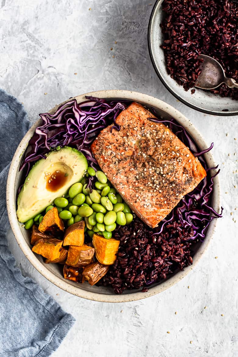 Salmon bowl with rice on the side 