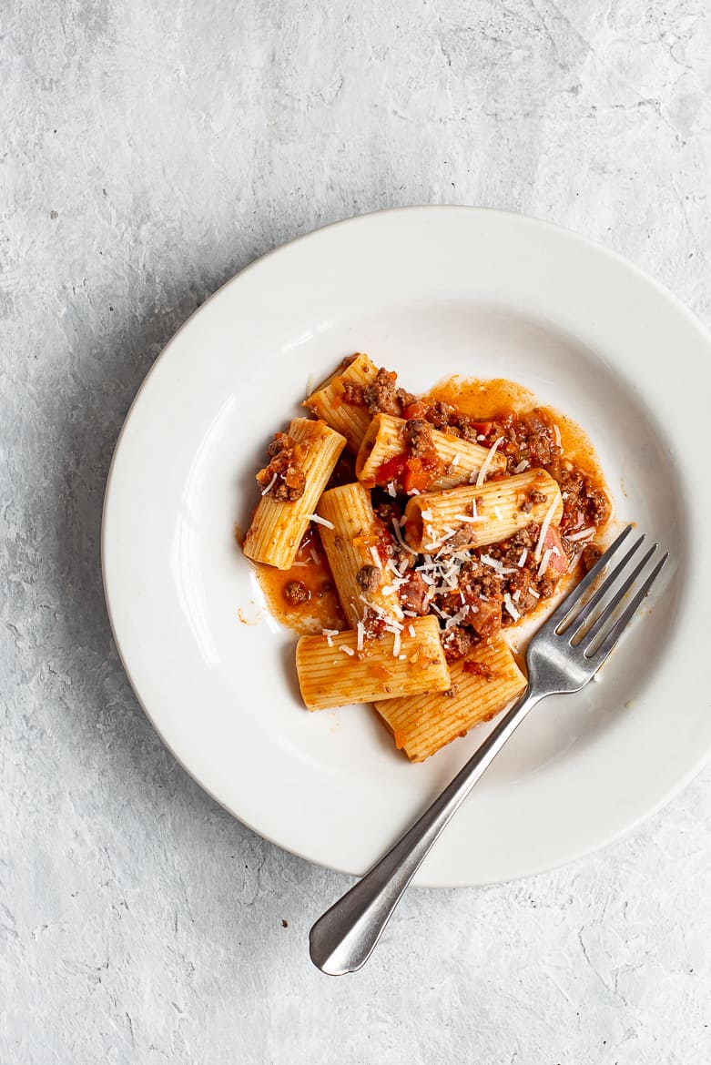 Bolognese with rigatoni pasta in bowl