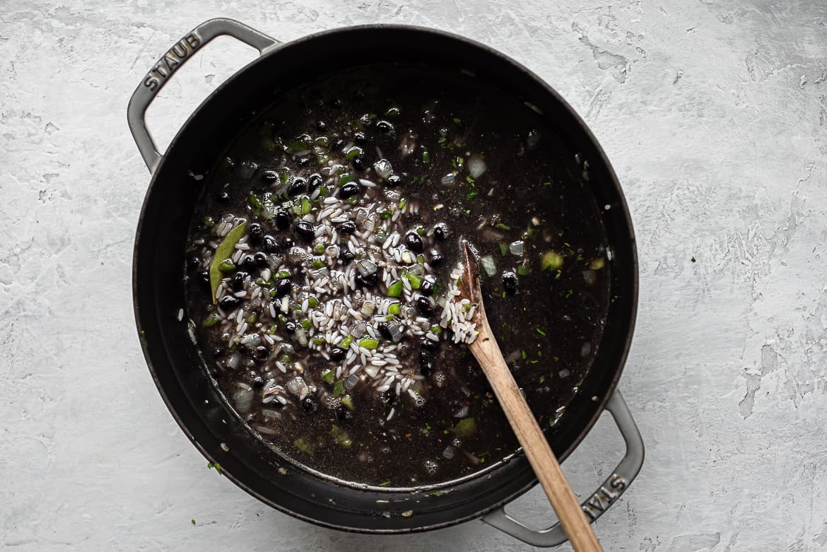 Black bean broth poured into pot