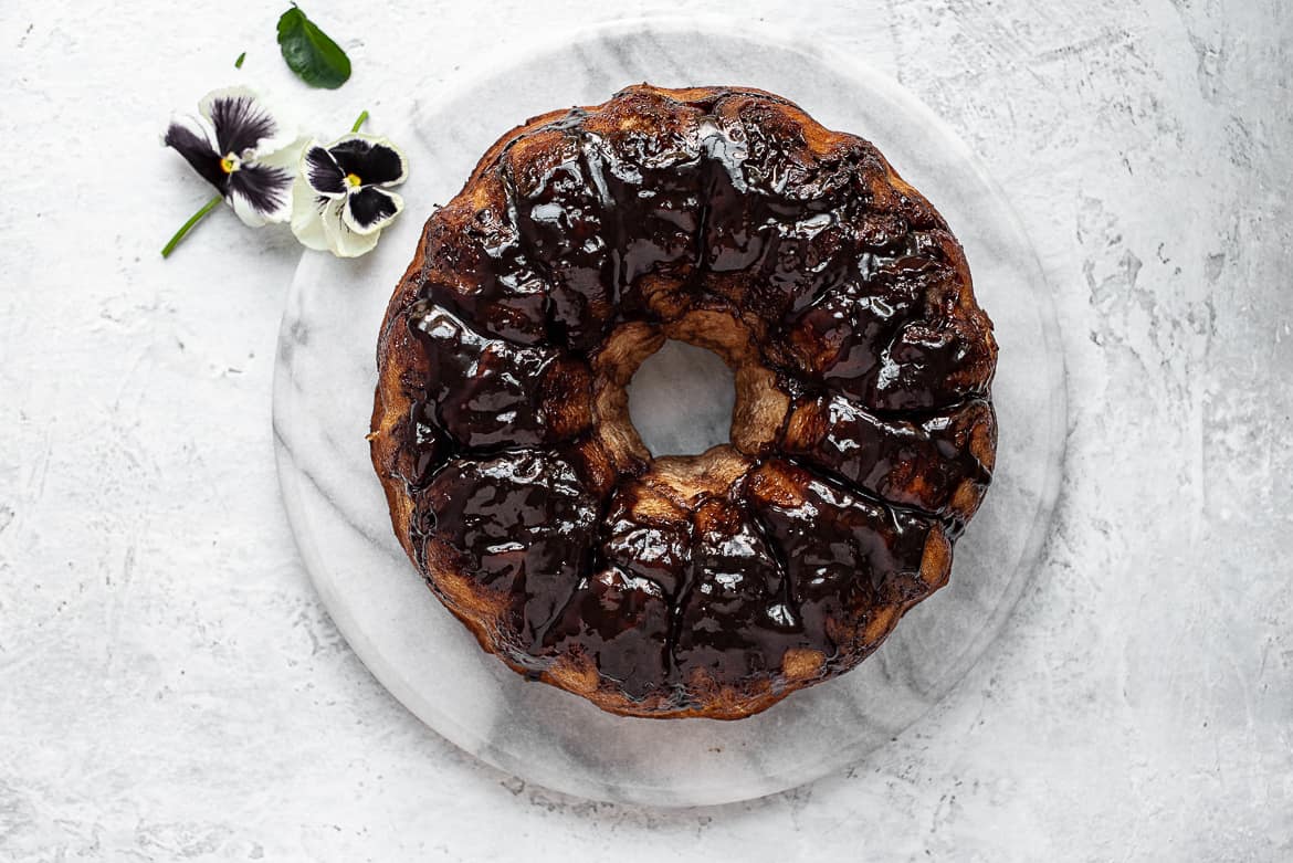 Chocolate monkey bread on platter with pansies