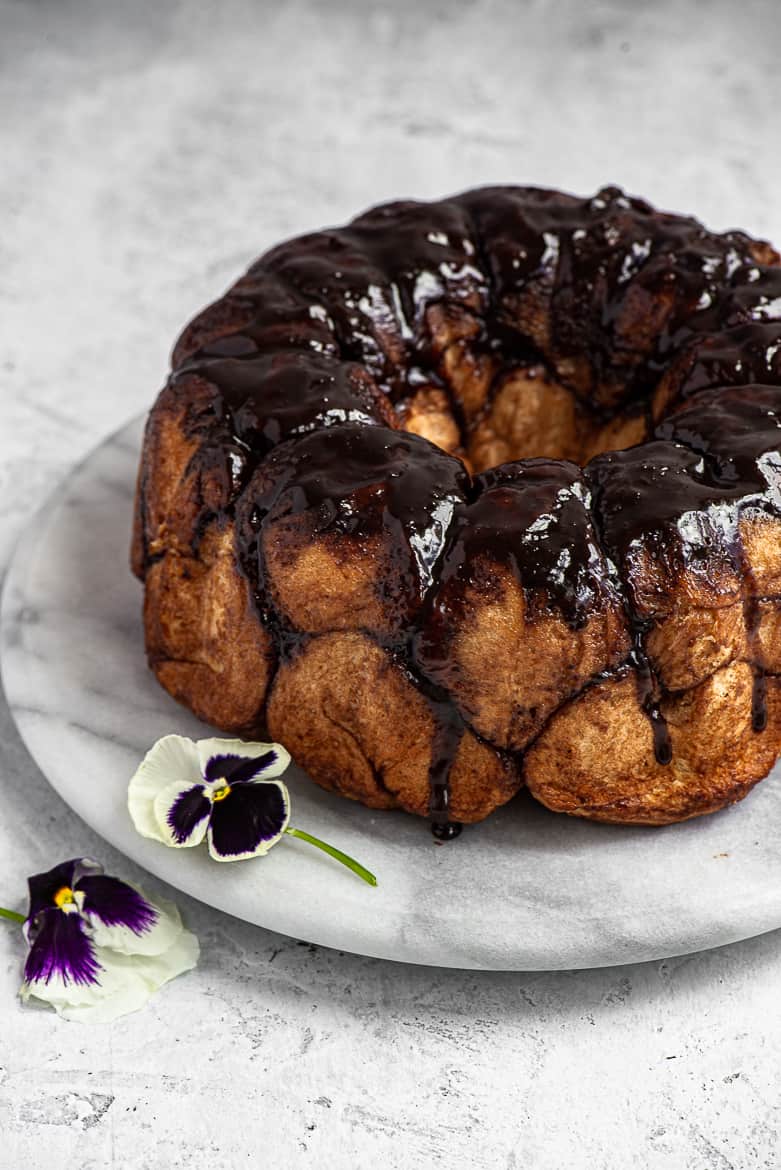Chocolate monkey bread on platter with pansies