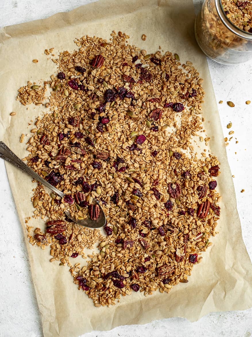 Homemade maple-pecan granola on parchment paper