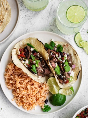 Steak Street Tacos with Mexican rice on a plate