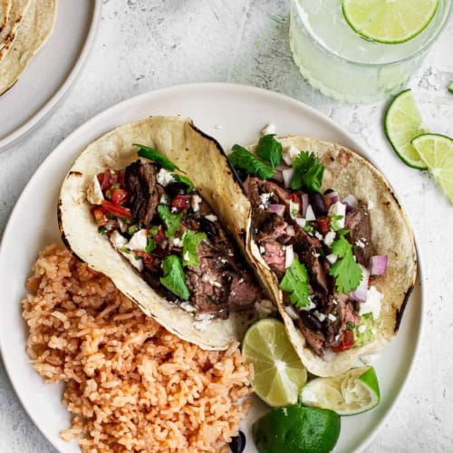 Steak Street Tacos with Mexican rice on a plate
