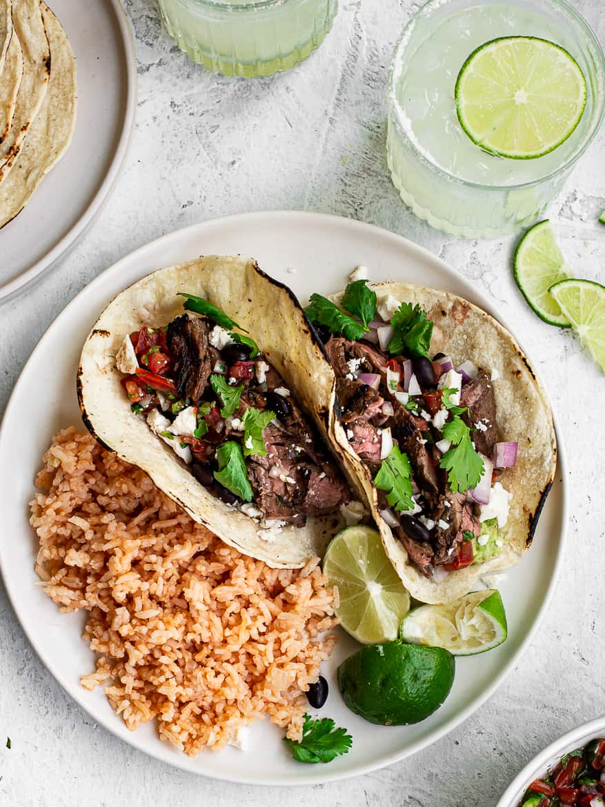 Steak Street Tacos with Mexican rice on a plate 