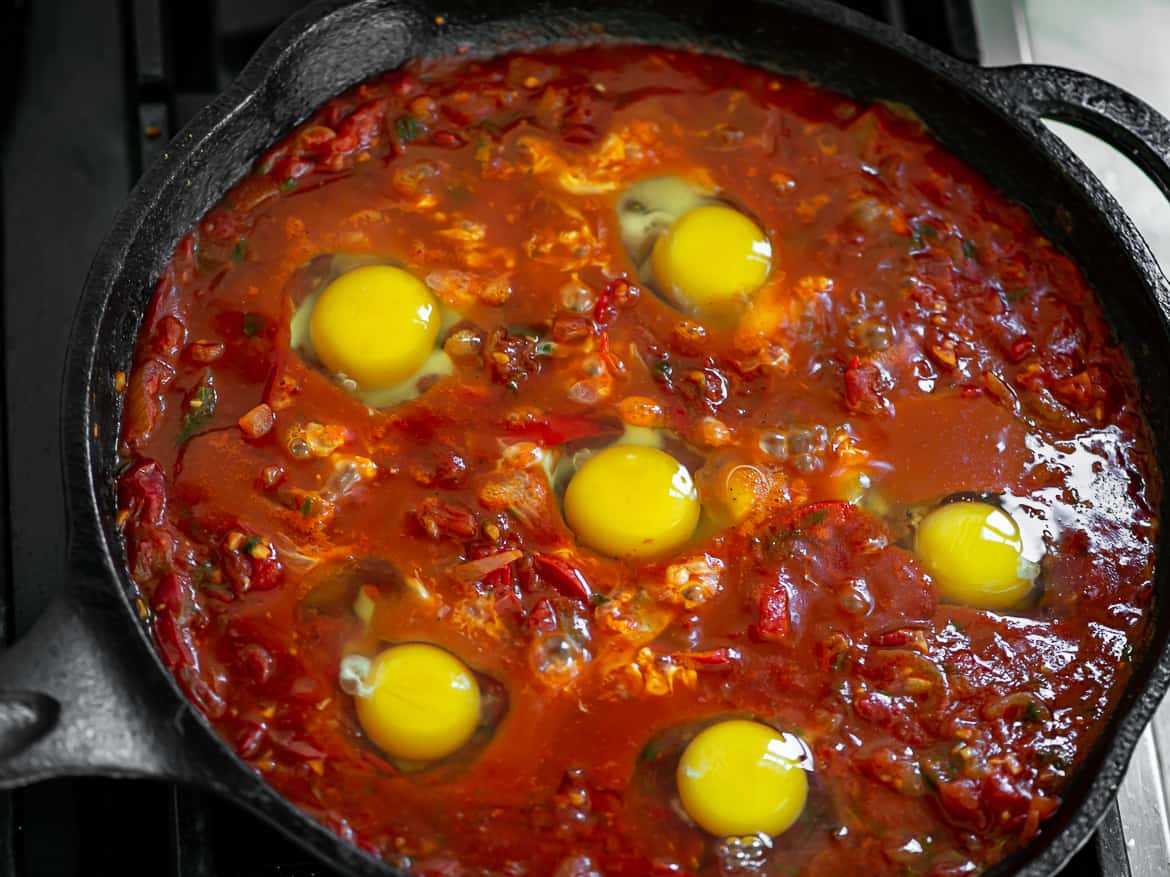 Cracking the eggs into the mixture