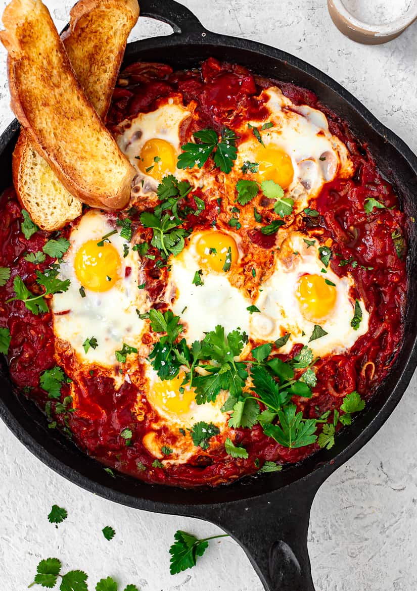 Shakshuka in skillet with challah