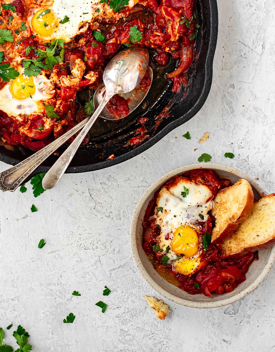 Shakshuka served in bowl with challah