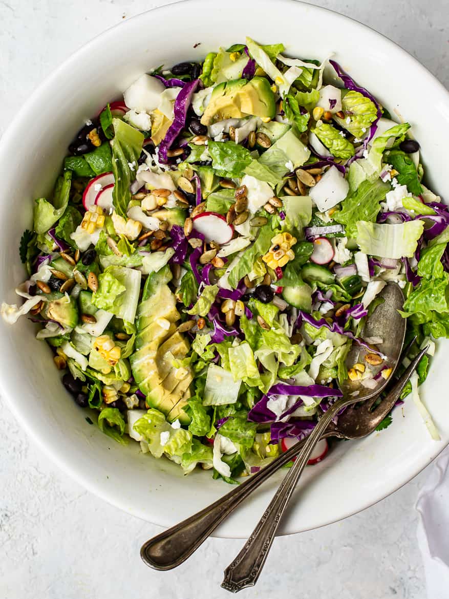 Close up of Mexican chopped salad with chipotle pepitas in bowl