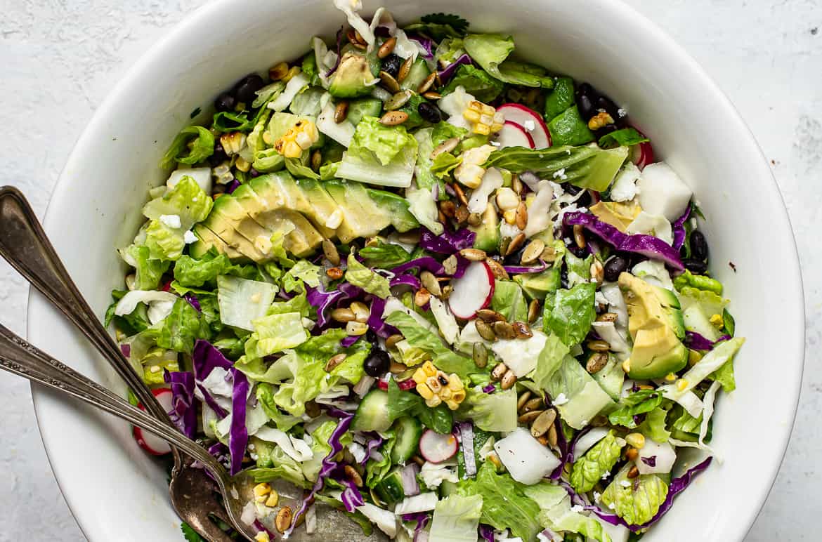 Close up of Mexican chopped salad with chipotle pepitas in bowl