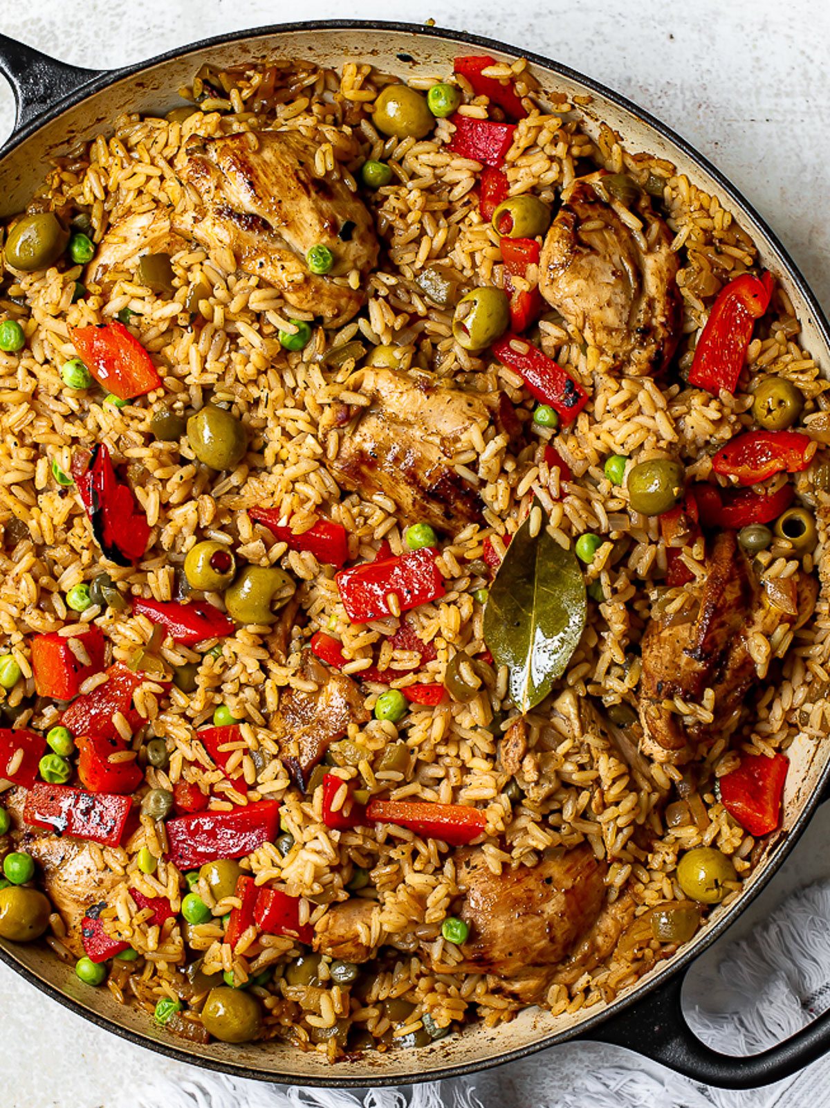 close up of cooked arroz con pollo in black skillet