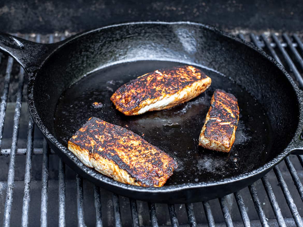 Fish cooking in skillet