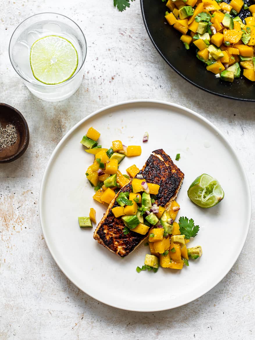 Blackened Fish with mango avocado salsa on plate