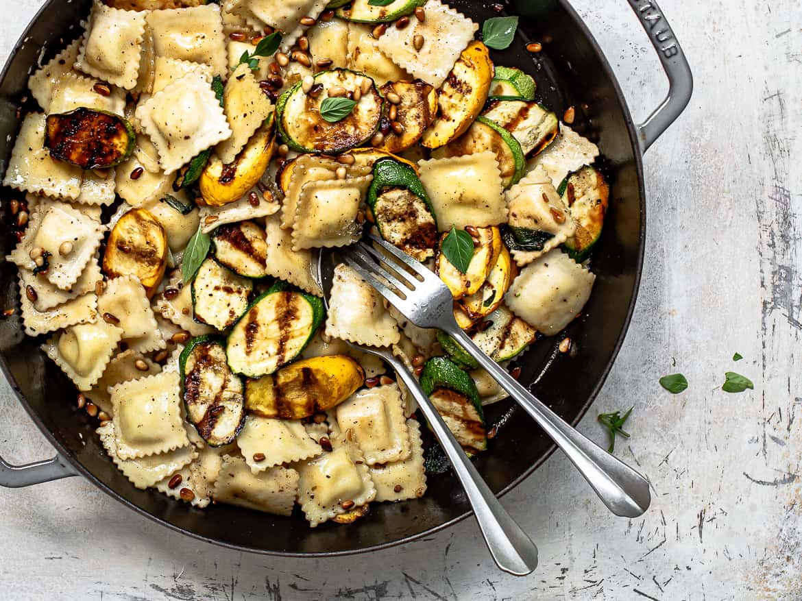 Close up of Ravioli Pasta with zucchini and summer squash in pan