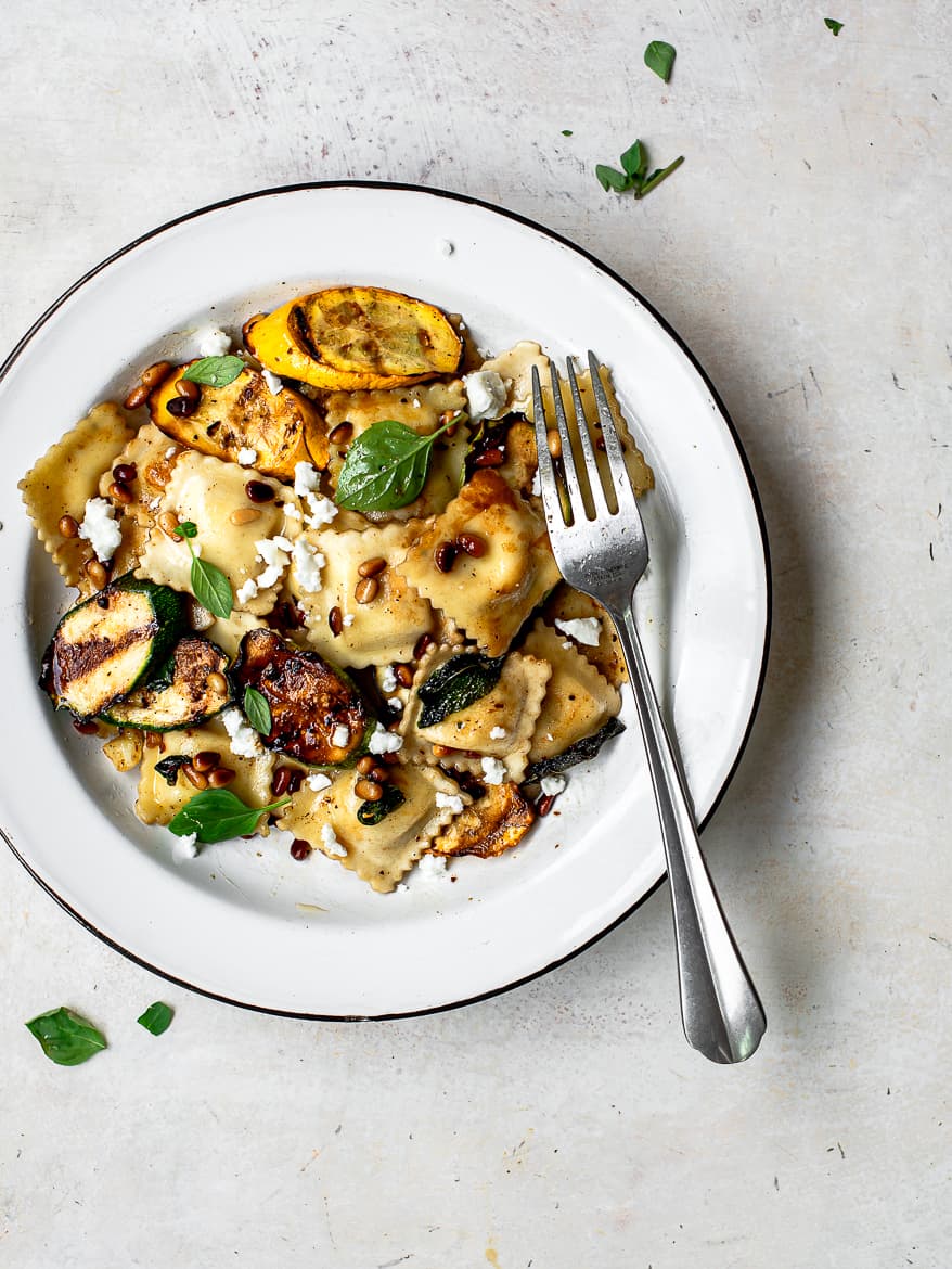 Ravioli Pasta with zucchini and summer squash on plate