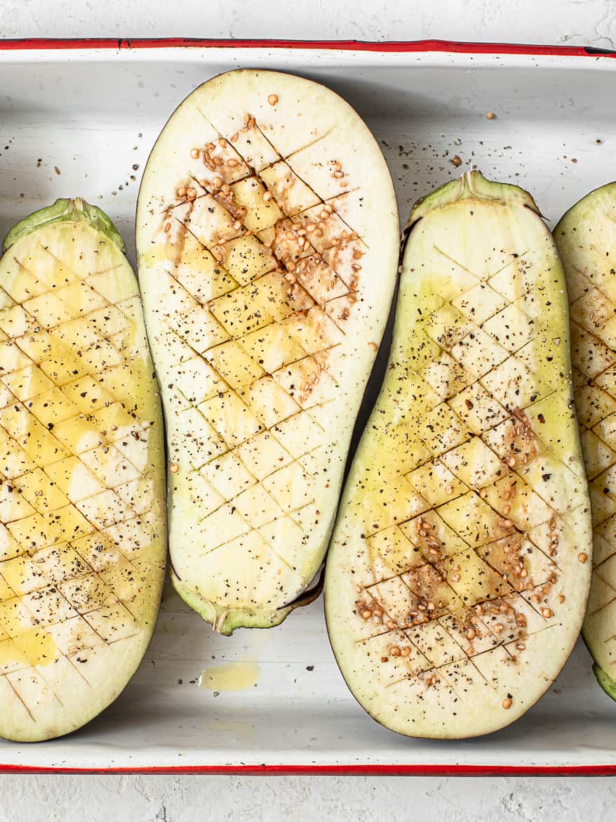 Eggplant with criss-cross pattern ready to roast