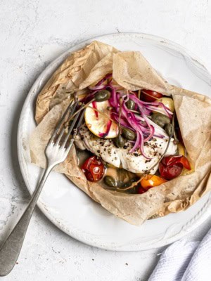 Fish en papillote served on plate